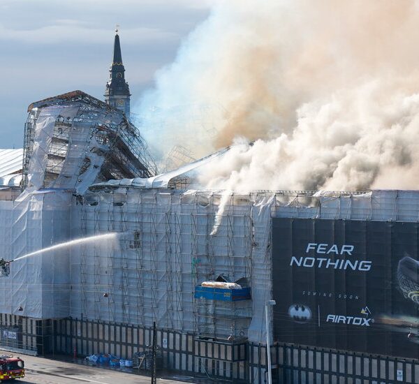 The old Copenhagen Stock Exchange building partially collapses in a fire